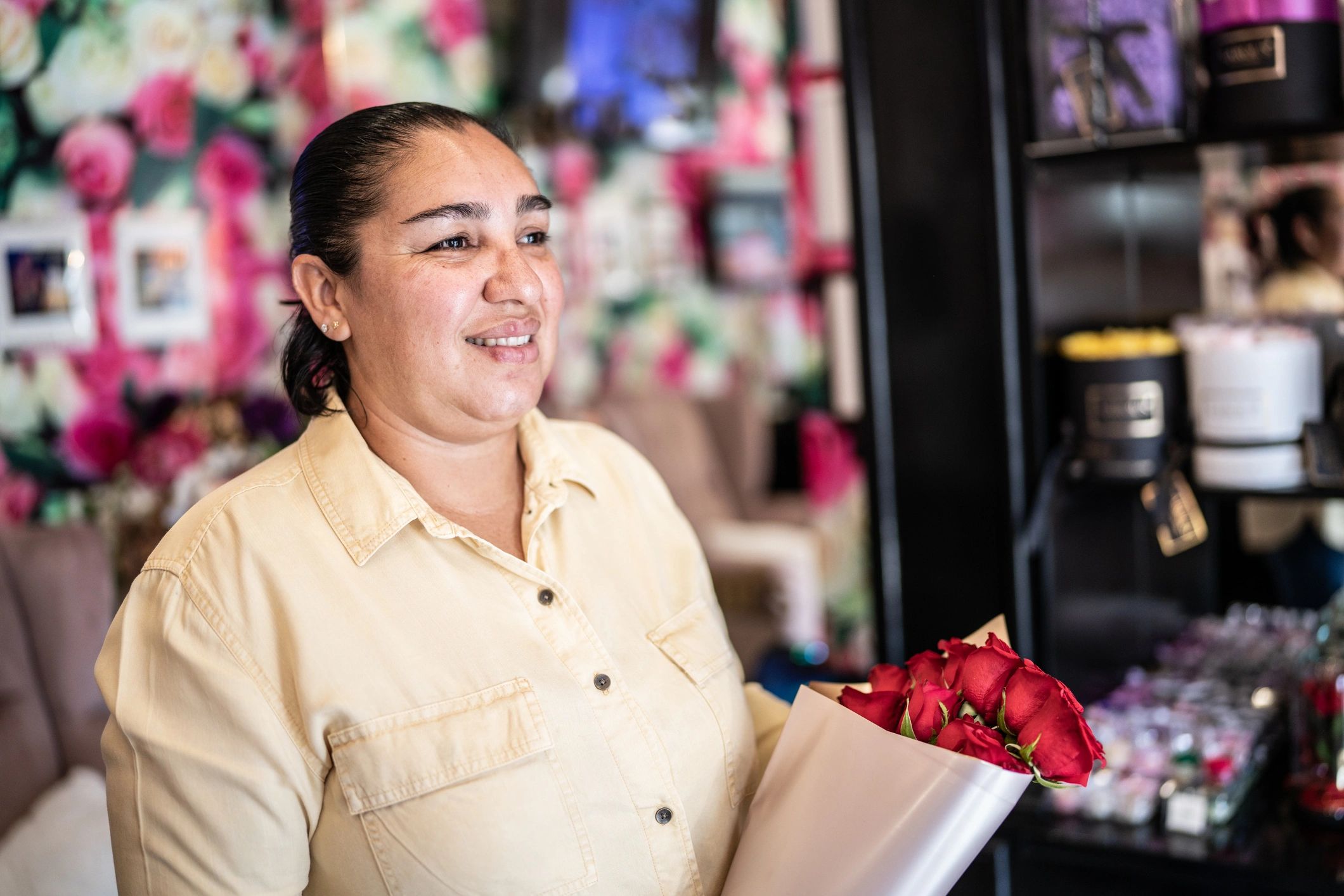 Customer holding a bouquet at a flower shop
