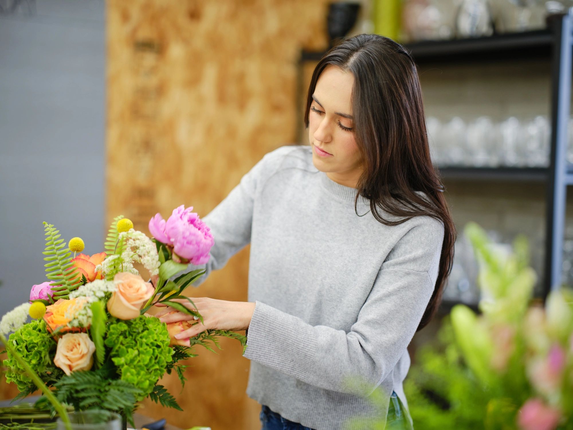 Flower shop staff working on arrangements