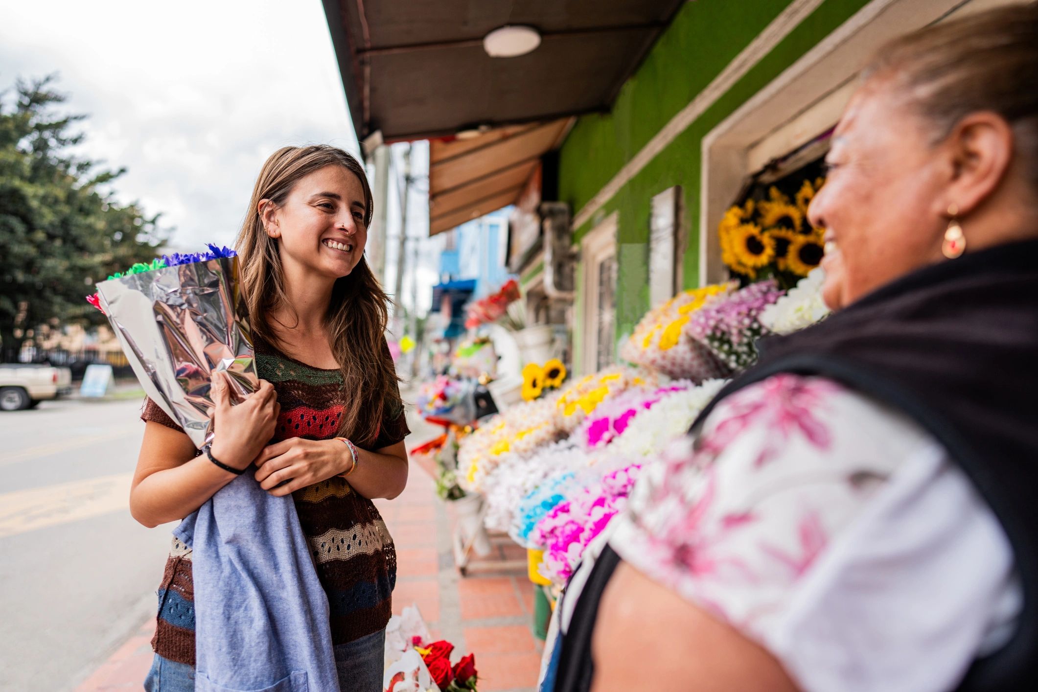 Customer speaking with a florist in a flower shop